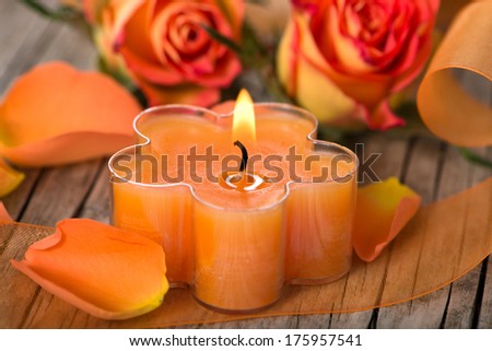 Candle with roses