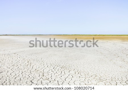 Camargue Rhone Park, cracked soil drought and horizon. Provence, France.