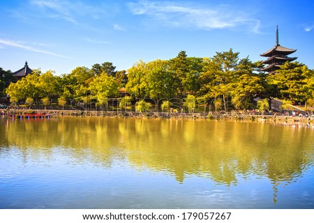 Park, pond reflection and Toji temple pagoda in Nara city. Japan, Asia.