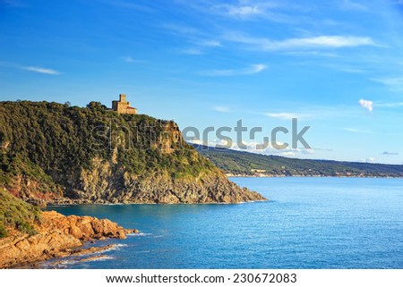 Cliff rock and building on the sea on sunset. Quercianella, Tuscany riviera, Italy, Europe.