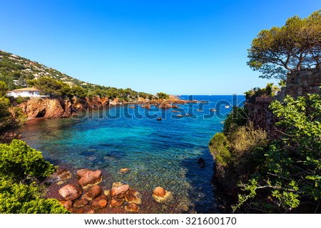 Esterel mediterranean red rocks coast, beach and sea. French Riviera in Cote d Azur near Saint Raphael, Provence, France, Europe.