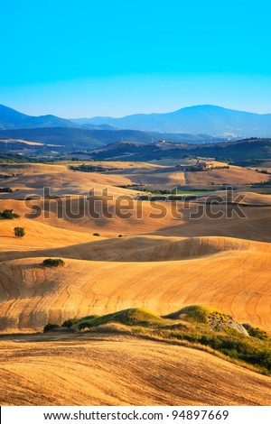 Typical landscape of Tuscany with field and rolling hills near Volterra, Italy.
