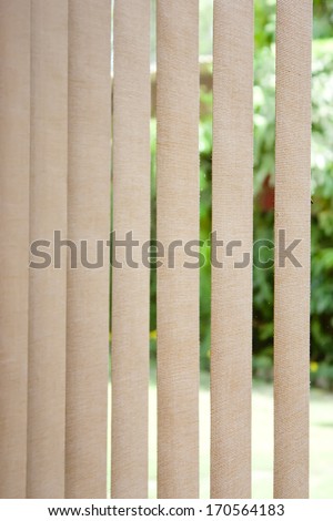 White vertical blinds as backdrop or background with sunlight