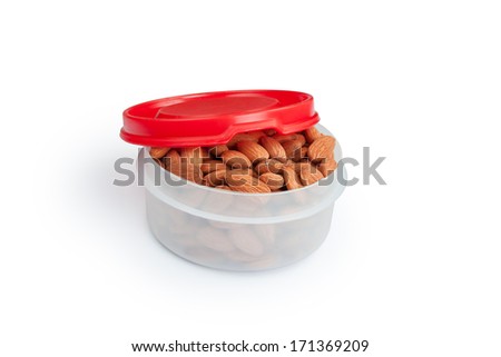 Pile of almonds in white plastic box isolated over white background