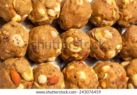 Collection of indian homemade  laddoo (sweet) made of roasted dry fruits wheat flour , edible oil , almonds and Cashew