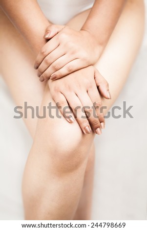 Beautiful feet and hand of a female indian isolated over white