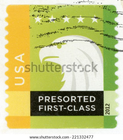 UNITED STATES OF AMERICA - CIRCA 2012: presorted first class mail post stamp printed in USA shows profile head of spectrum bald eagle and five stars, 25c yellow green white, Scott 4587; circa 2012