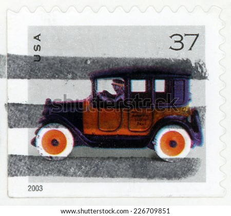 UNITED STATES OF AMERICA - CIRCA 2003: post stamp printed in USA (US) shows car toy american yellow taxicab, Scott 3641 A2816 37c orange black, circa 2003