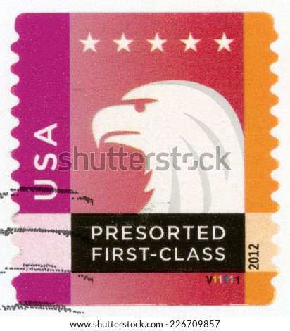 UNITED STATES OF AMERICA - CIRCA 2012: presorted first class mail post stamp printed in USA shows profile head of spectrum bald eagle and five stars, Scott 4588 25c white orange purple, circa 2012