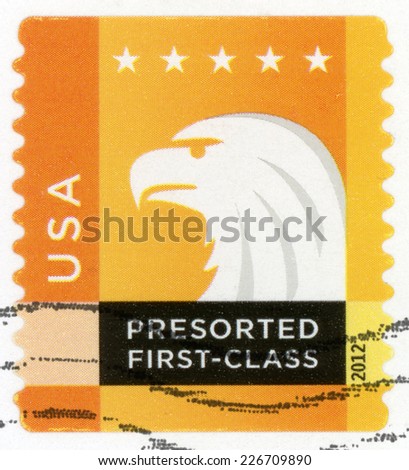 UNITED STATES OF AMERICA - CIRCA 2012: presorted first class mail post stamp printed in USA shows profile head of spectrum bald eagle and five stars, Scott 4589 25c white orange yellow, circa 2012