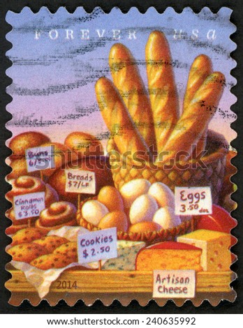 UNITED STATES OF AMERICA - CIRCA 2014: forever stamp printed in USA shows food on table: baguettes in basket, buns, cinnamon rolls, breads, cookies, eggs & artisan cheese; farmerÃ¢Â?Â?s markets; circa 2014