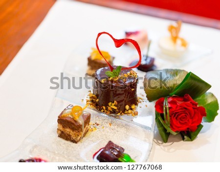 holiday dessert with caramel heart of Saint Valentine\'s Day in the restaurant