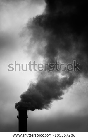 Environmental Damage: Air Pollution. The black smoke of the pipe.
