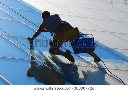 Window cleaner works on high rise building.Window cleaning is considered one of the most dangerous job in the world.