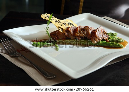 Duck stuffed vegetable by under cognac sauce with an asparagus
