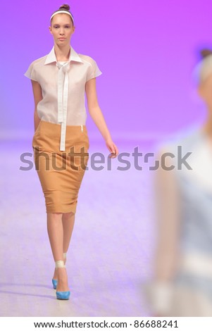 KYIV, UKRAINE - OCT. 14, 2011: Model walks the runway during Fashion Show by \