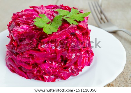 Healthy salad from boiled beet on white plate