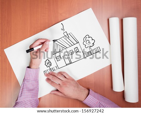 Person draws a house of their dreams, top view