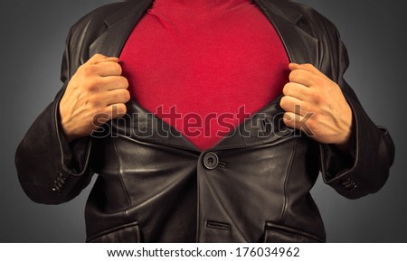 Unrecognizable man opens suit showing red t-shirt, space for text