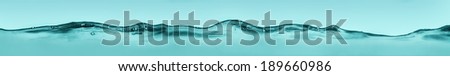 Water wave background of turquoise color
