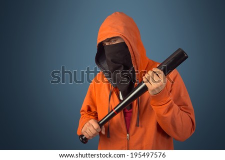 Man in hood and mask holds baseball bat