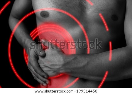 Man holds on the right side of the abdomen, concept of pain, pain area of red color