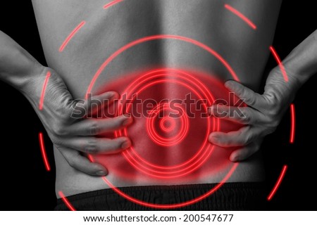 Acute pain in a male lower back, black and white image, pain area of red color