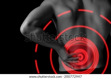 Man is touching the lower back, pain in the kidney, black and white image, pain area of red color