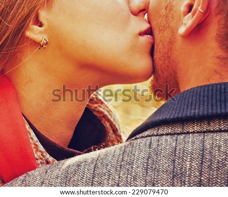 Close-up image of loving kissing couple, view of lips, unrecognizable couple in love