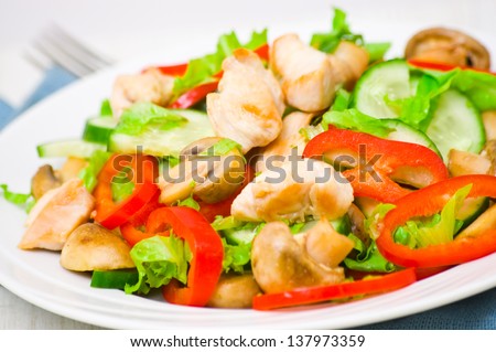 salad with chicken, mushrooms and vegetables