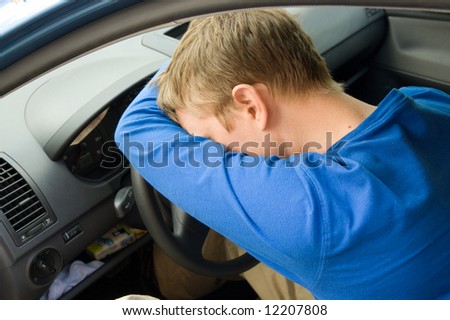 man sleeps in a car