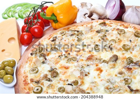 Fresh italian pizza with chicken and cream sauce, on a thick dough with ingredients on a white background.