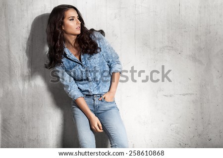 Latin woman in jeans and a denim shirt