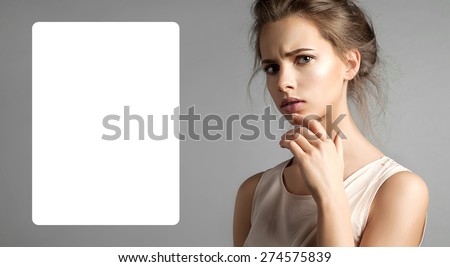 Attractive doubting woman asks with ad white poster