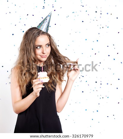 Beautiful woman with a birthday cake make a wish