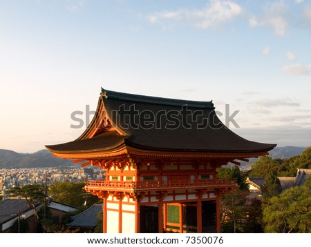 Gateway of Kiyomizu Temple in Kyoto Japan, with the city of Kyoto in the background. Kiyomizu-dera is one of the most famous and most visited temples in Kyoto.