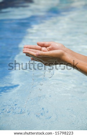 Clearfresh water falling from hands