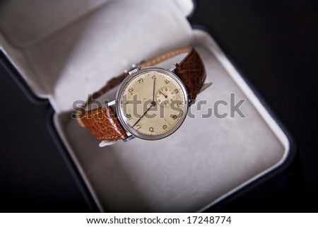Closeup of silver old watch in box