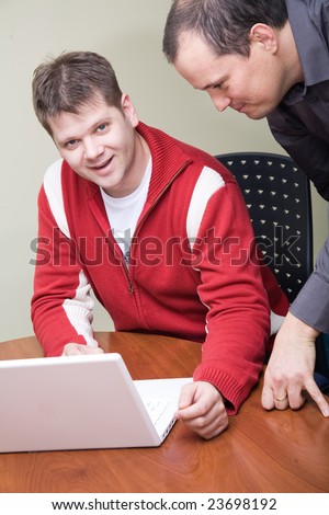 Two people with a with laptop computer