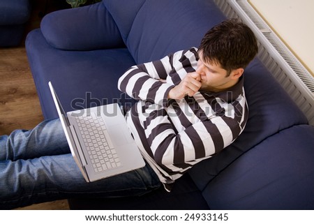 Young man work with computer at home