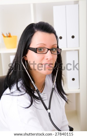 Beautiful young doctor in doctor's office