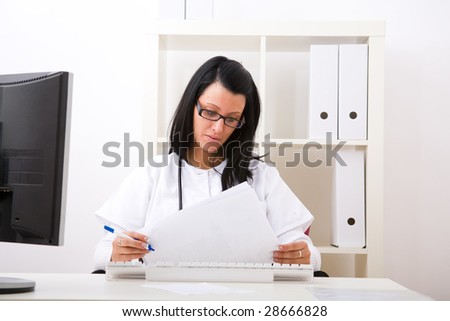 Beautiful young doctor in doctor's office
