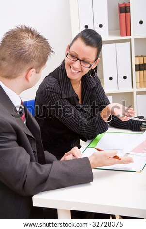 Business man and business woman working in office