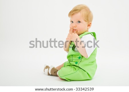 Little baby boy in green a pair of trousers