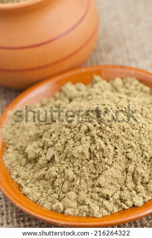 ceramic dishes filled with raw organic hemp protein powder