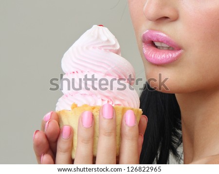 girl eats  cake. Largely lips and  cake.