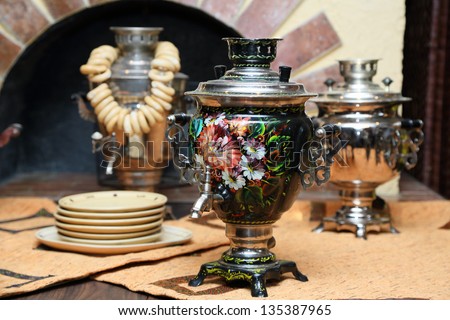 russian samovar. on table with  dishes.