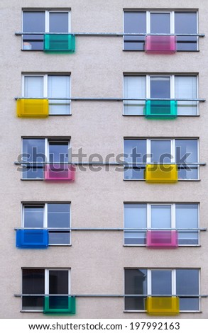 Ten windows with colorful safety barriers of modern living house.