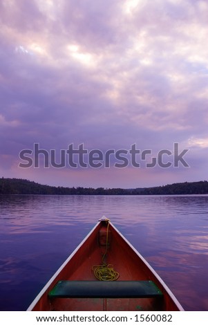 boat at sunset on lake