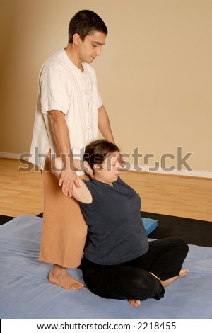 man stretching woman client in massage thai